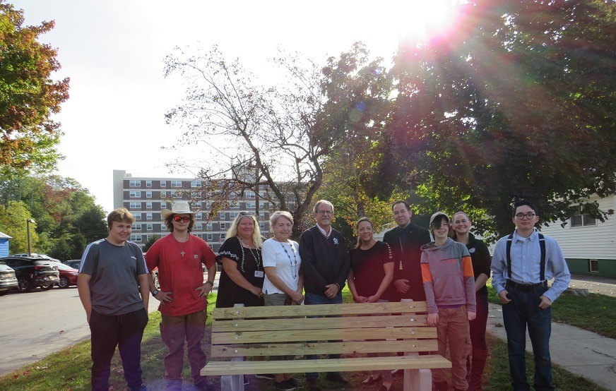 Community Partners Pose with Bench